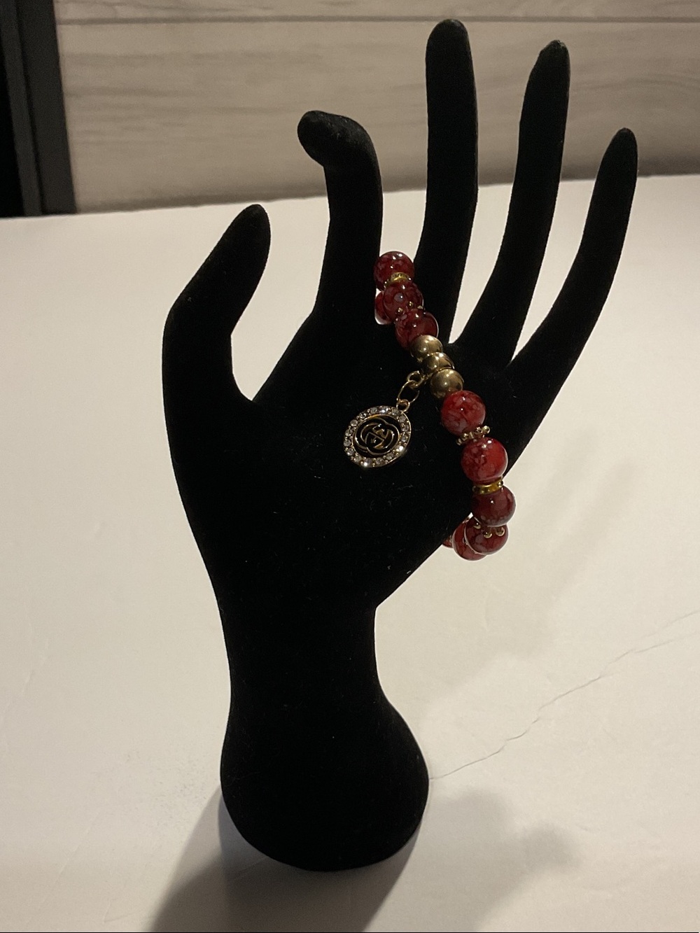 Red Beaded Bracelet with Gold Charm - Logo Accent
